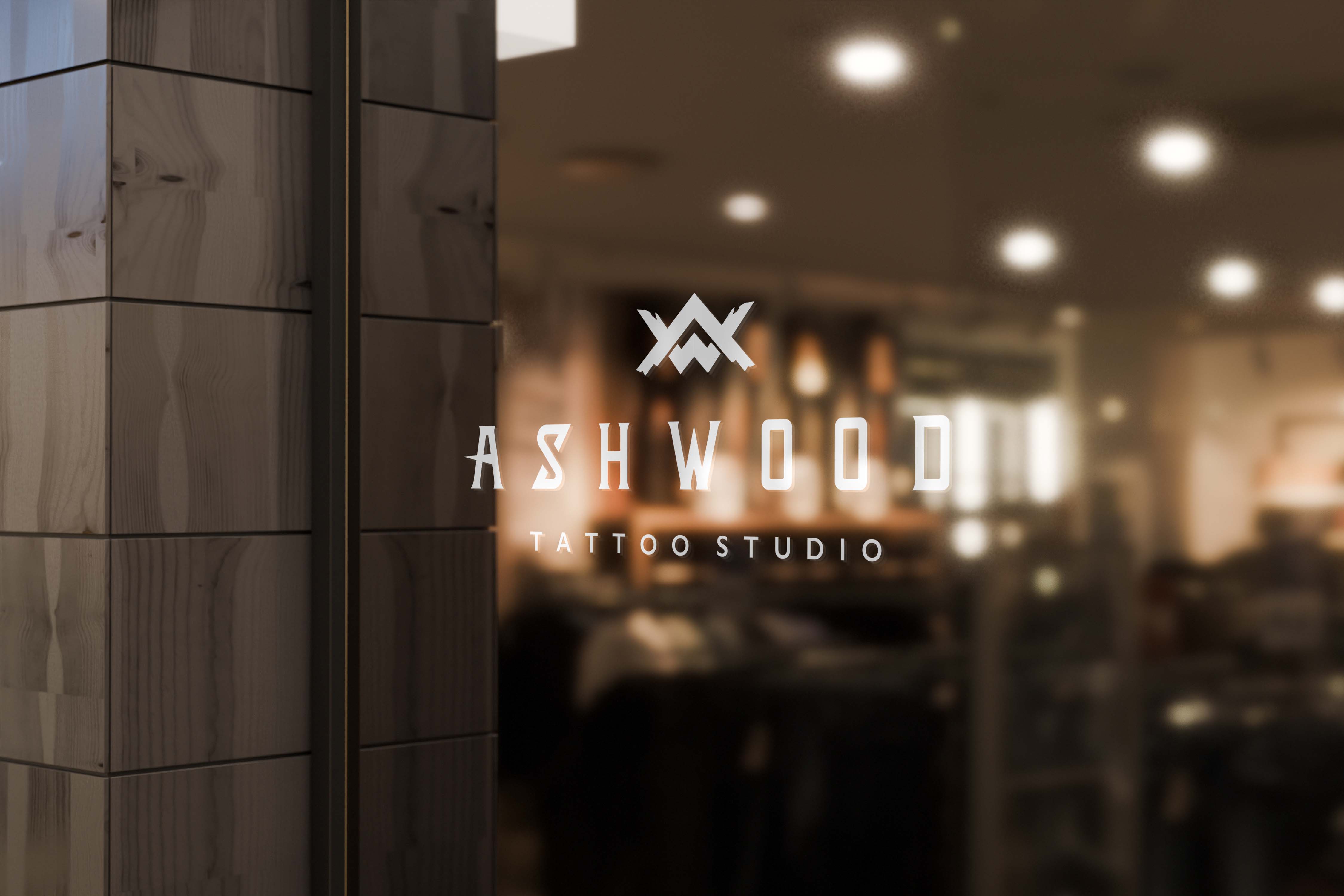 Ashwood Tattoo Studio — logo on studio window, warm interior