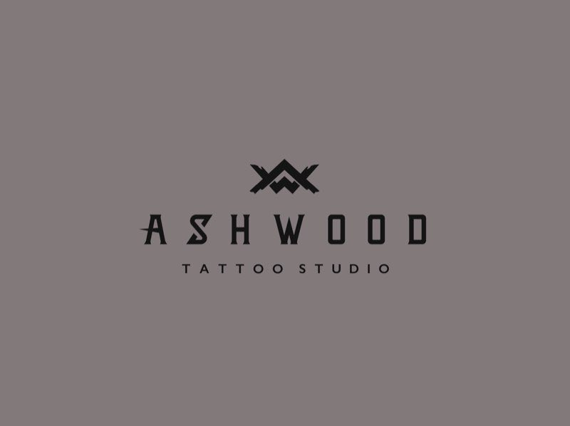 Ashwood Tattoo Studio wordmark and crossed-axe mark