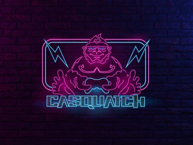 Casquatch logo in neon on a brick wall