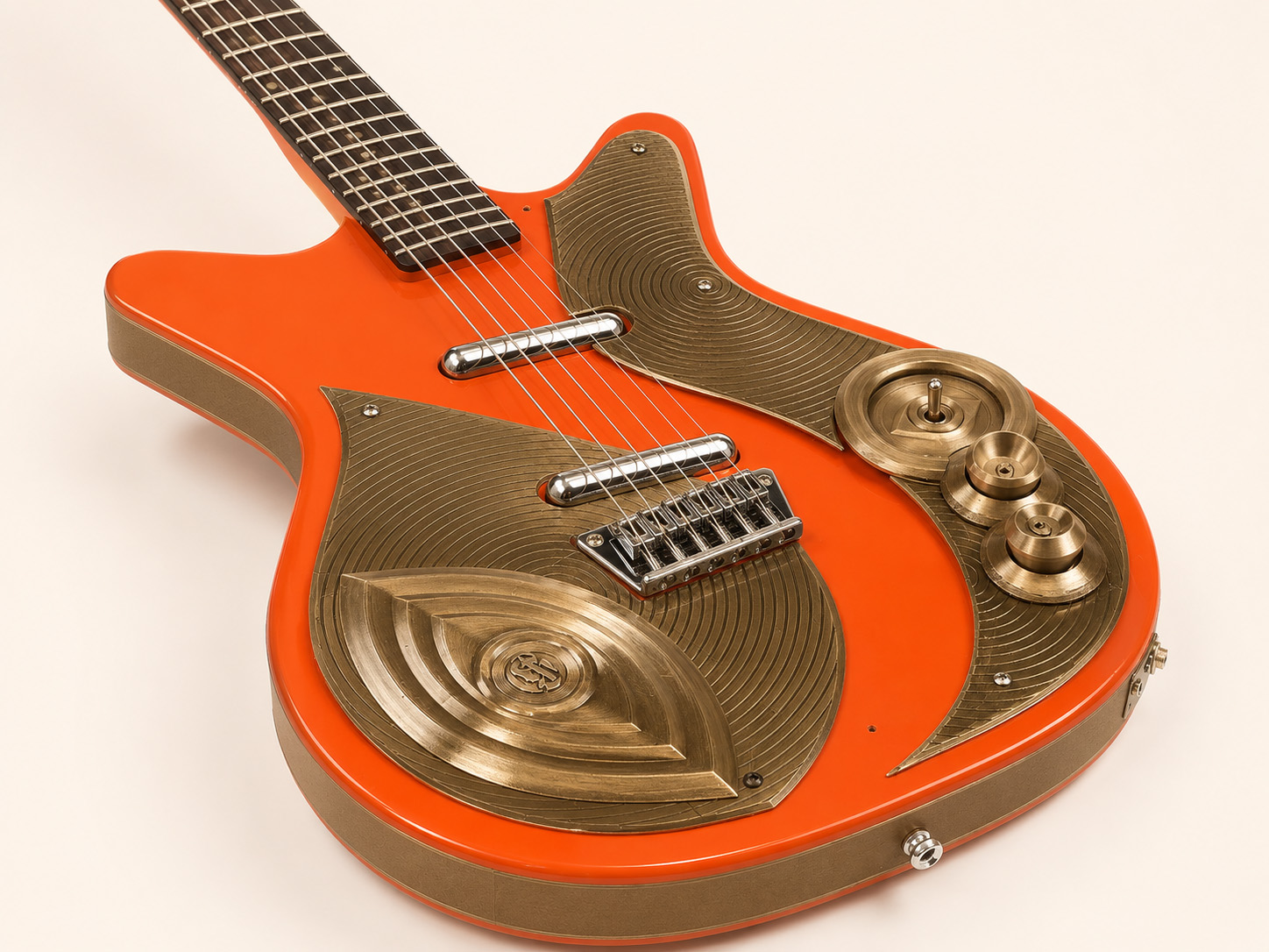 Custom Danelectro — brass body detail, eye motif and control knobs